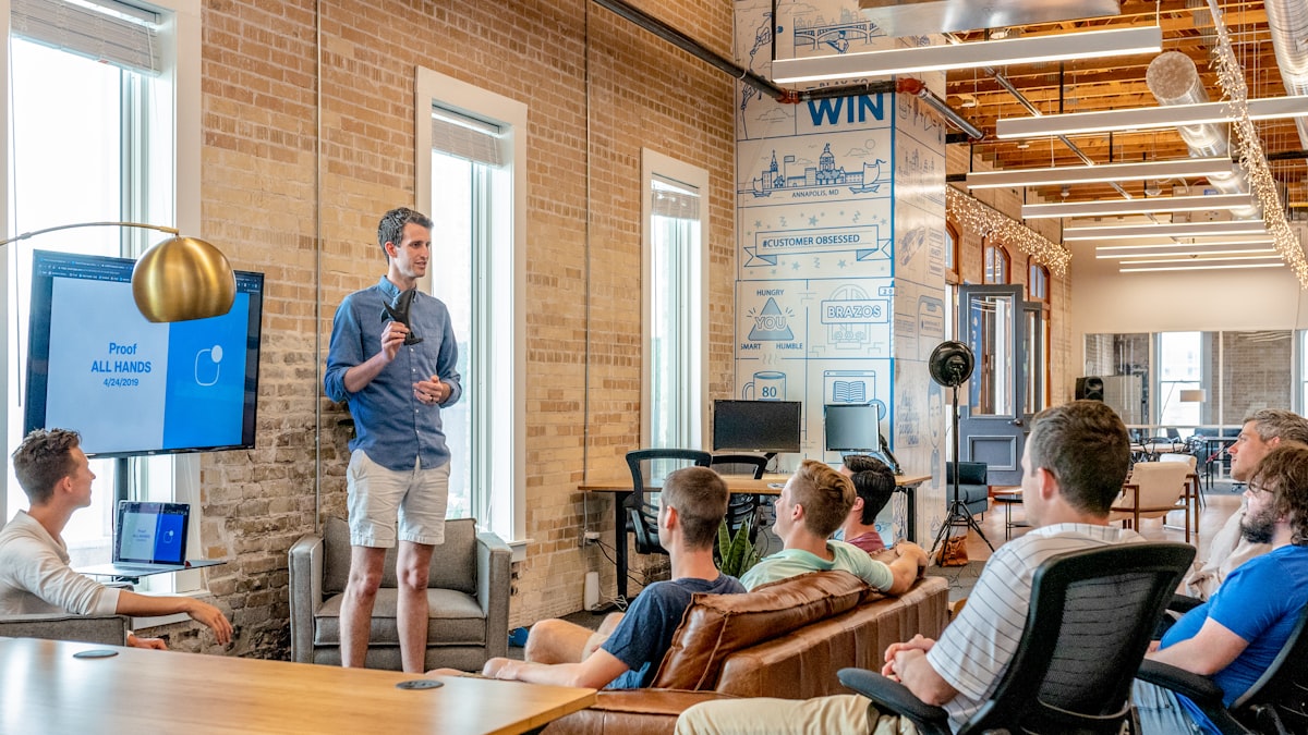 Small business owner presenting to colleagues in an office